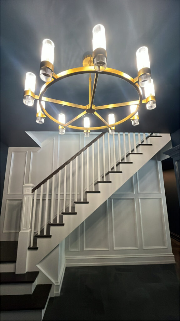 Interior painting project in Scarsdale NY with dark ceiling contrast and crisp staircase millwork