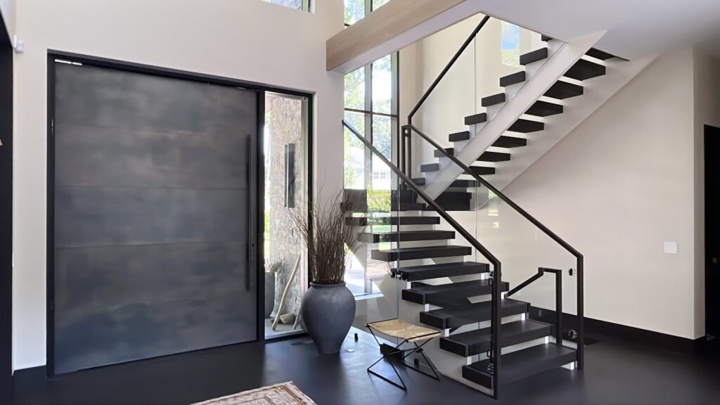 Interior painting project in Wilton CT with a bold staircase and bright modern walls