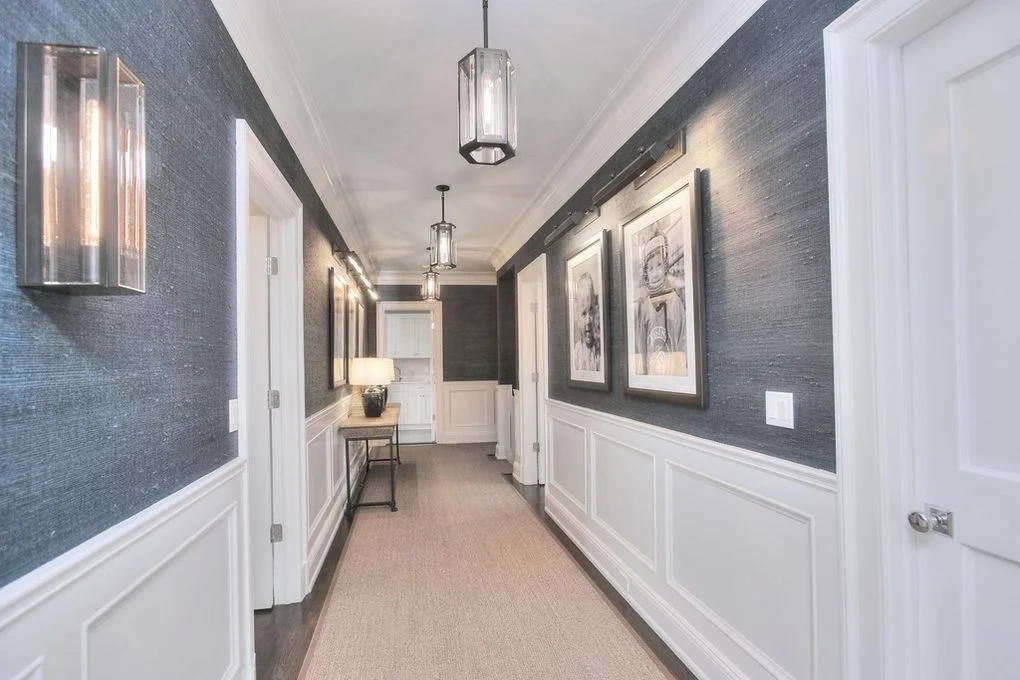 Wallpaper installation project in New Canaan CT with textured hallway wallcovering and crisp trim