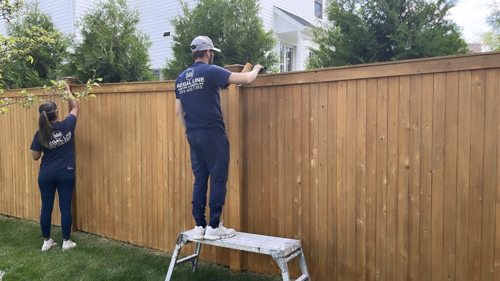 Fence painting project in Fairfield CT with fresh wood finish and even coverage