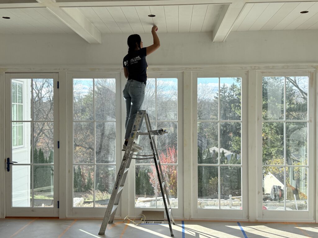 House painting project in Westport CT with bright white walls and smooth window trim