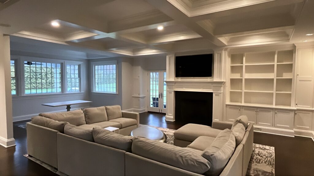 Living room painting project in Darien CT with coffered ceiling and warm family-room finish