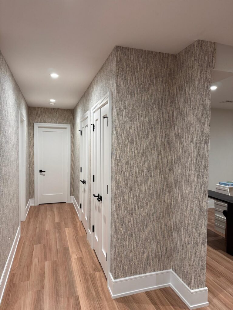 Wallpaper installation project in South Salem NY with textured neutral hallway wallcovering