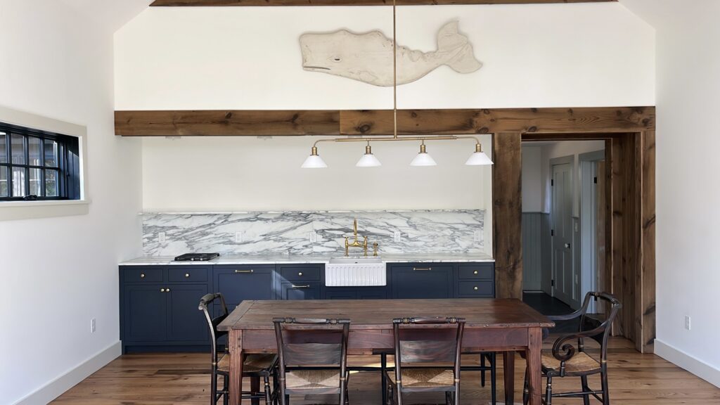 Interior painting project in Pound Ridge NY with bright white walls and navy cabinetry accents